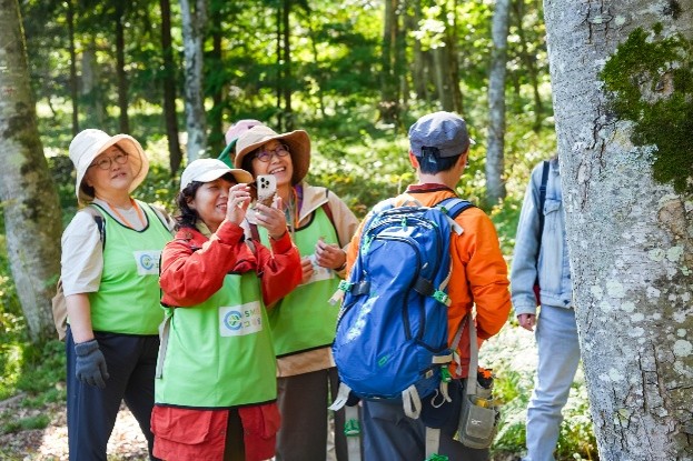 Participants walking through the forest, guided by Afan Woodland Trust staff